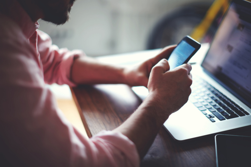 man_phone_laptop_small